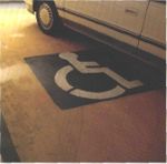 Handicapped logo on floor under car.